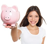 Woman in white tshirt holding a pink piggy bank in her hand.